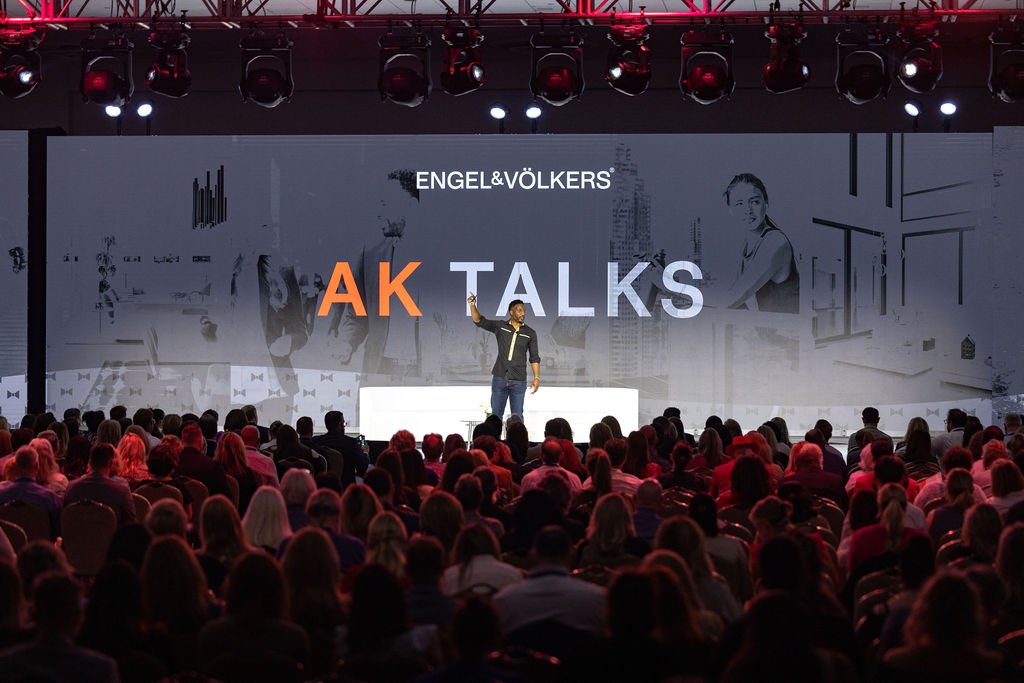 coach ak speaking on stage